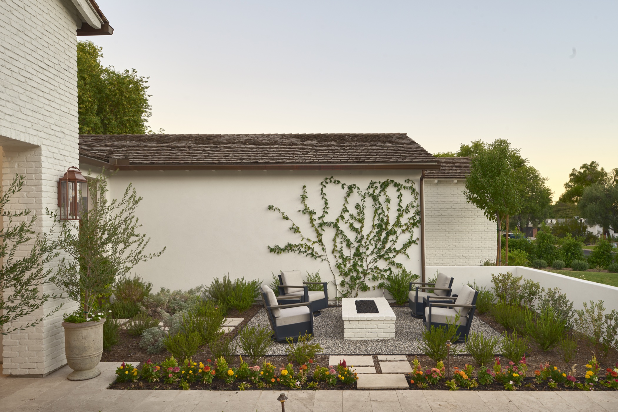 Landscaped courtyard and outdoor fireplace at 53rd Place