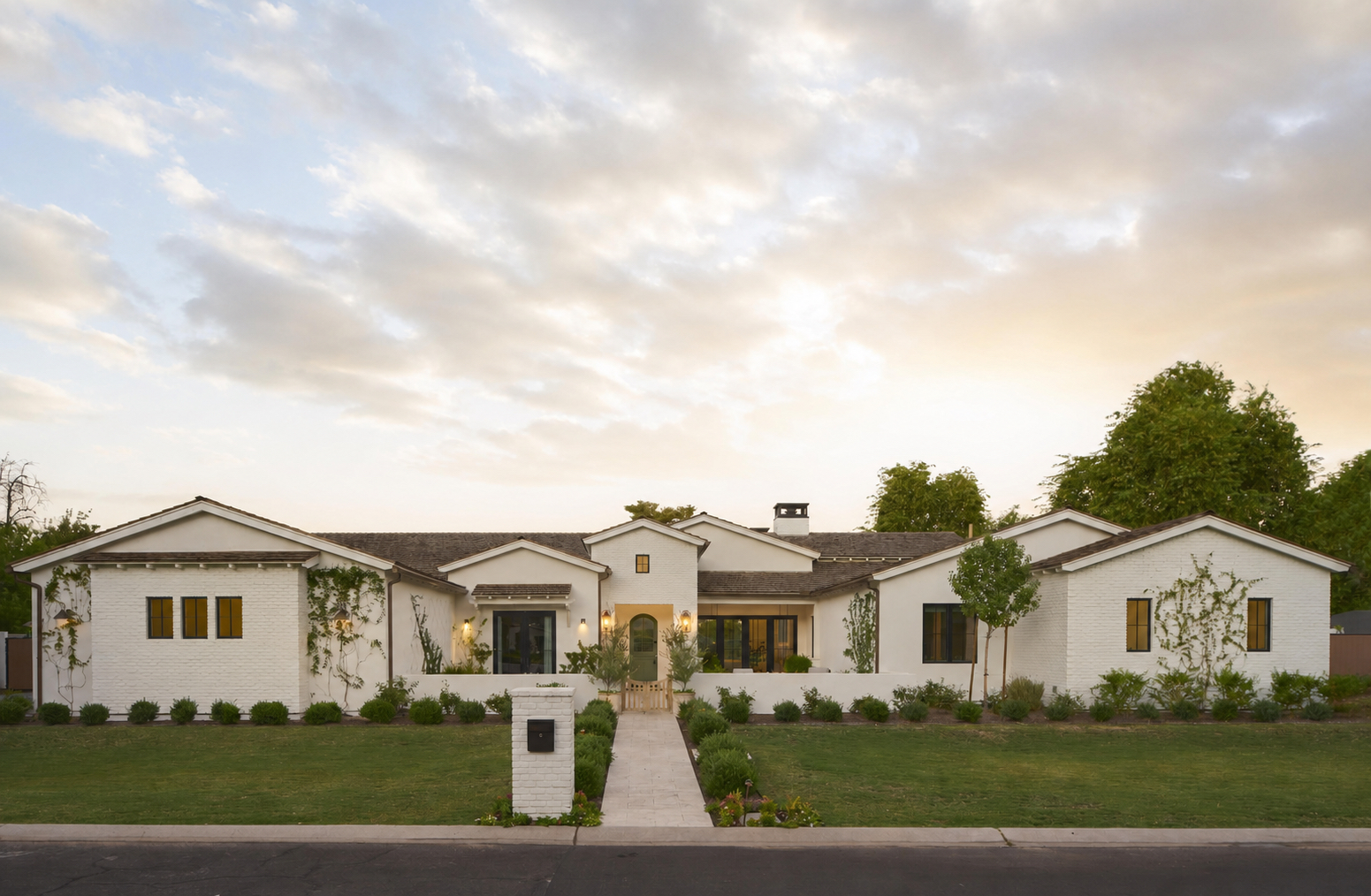 White brick exterior and established landscaping at 53rd Place