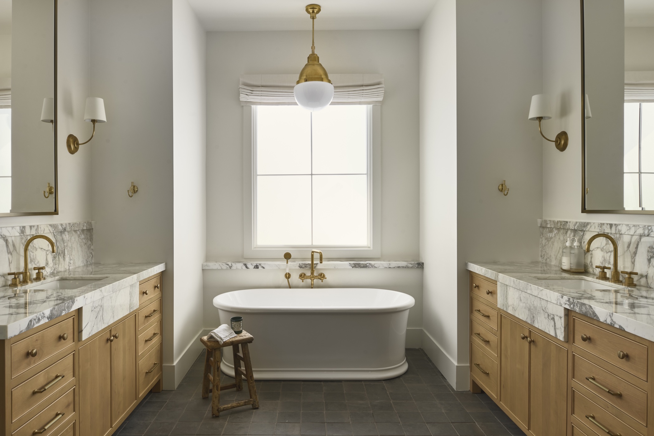 Oak bathroom vanities and a freestanding tub
