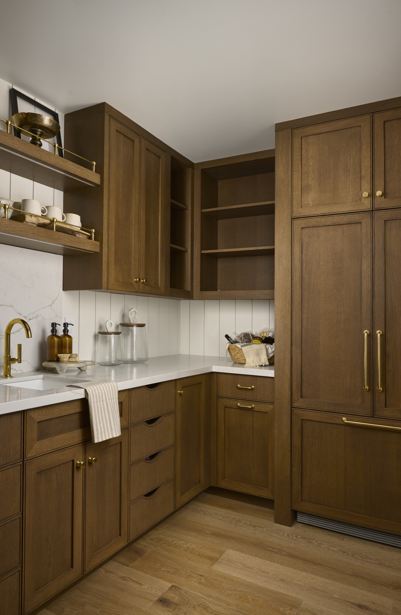 Paisano Circle pantry with warm wood cabinetry